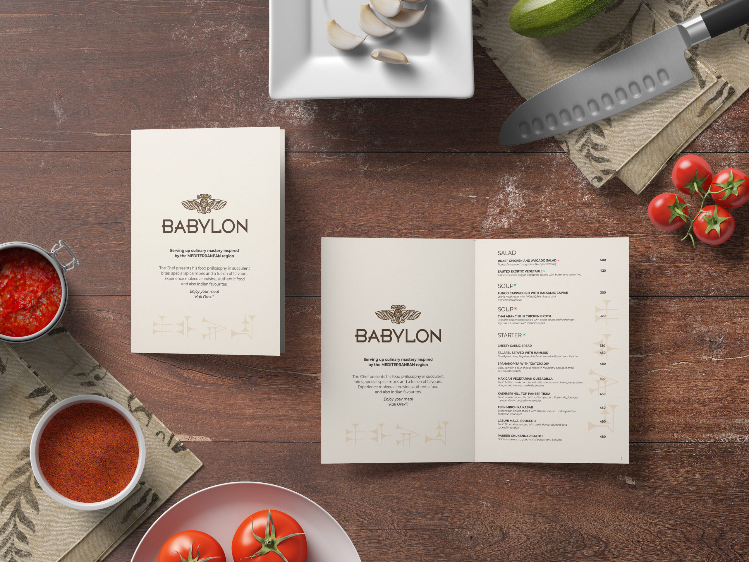 Babylon menu pages arranged on a wooden food preparation table