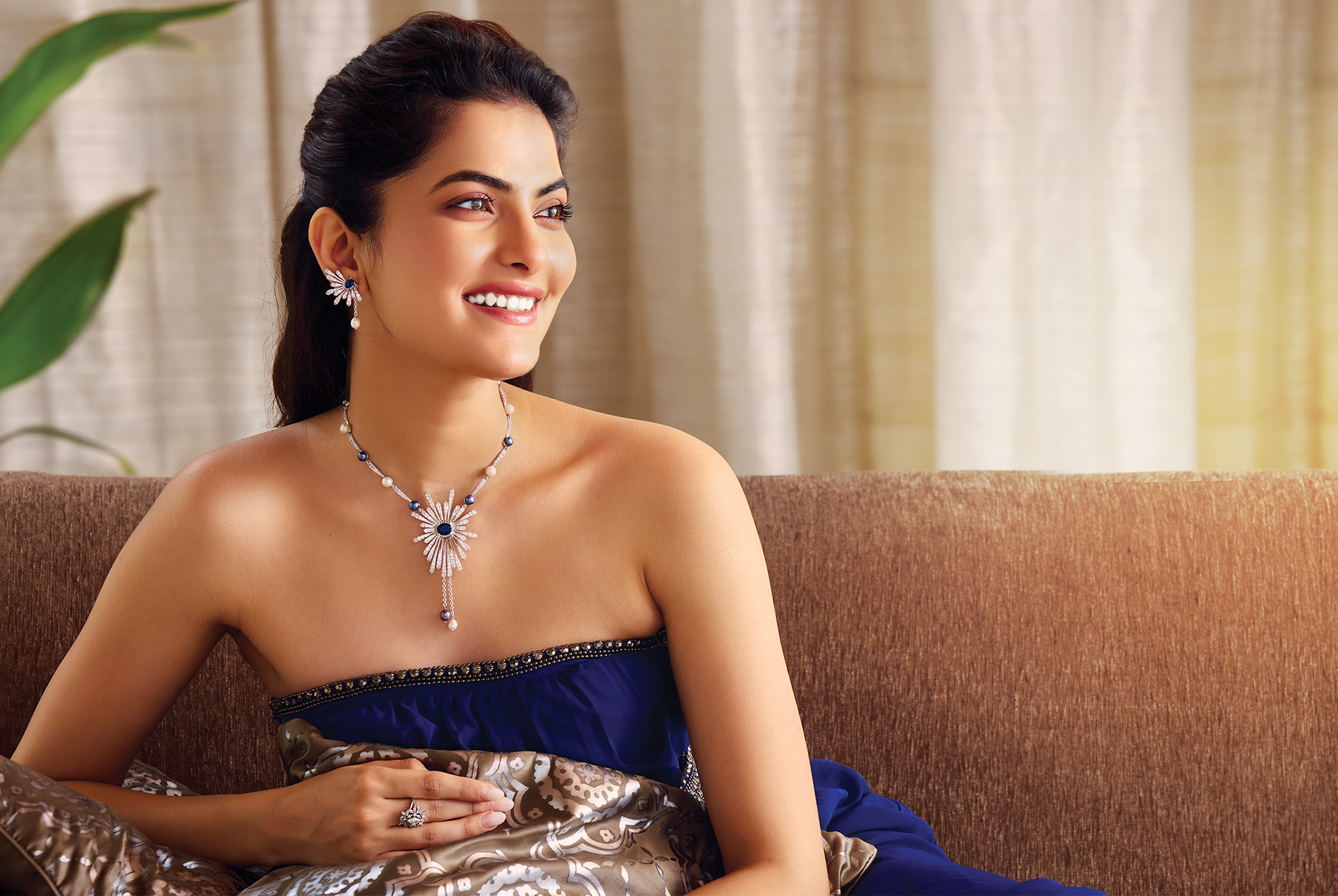 Chandrani Pearls jewellery campaign portrait with a blue pendant necklace